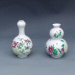 A Set Of Two Over Glazed Floral Vases