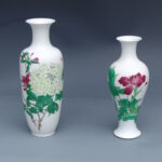 A Set Of Two Over Glazed Floral Vases