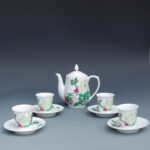 A Set of Over Glazed Floral Teapot and Cups