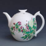 An Over Glazed Floral Teapot