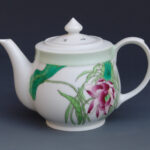 An Over Glazed Floral Teapot
