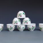 A Set Of Eight Over Glazed Floral Cups