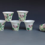 A Set Of Eight Over Glazed Floral Tea Cups