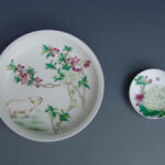 A Set Of Two Over Glazed Floral Plates