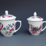 A Set Of Two Over Glazed Fruits Tea Cups