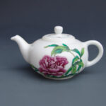 An Over Glazed Floral Teapot
